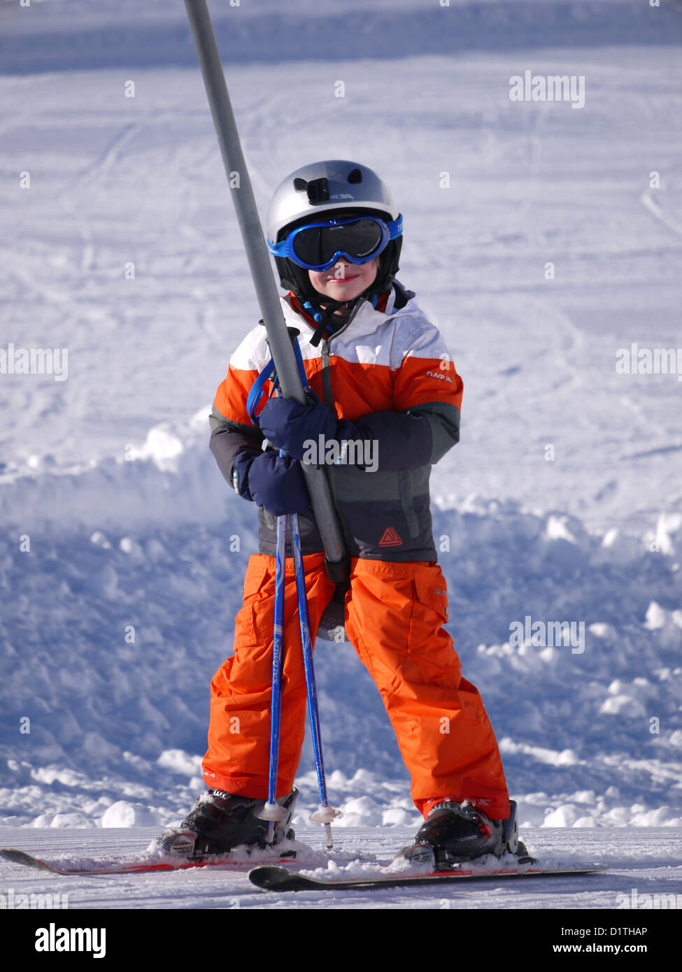 Small boy  on the piste at Isenau above the ski resort of Les Diablerets, Switzerland Stock Photo