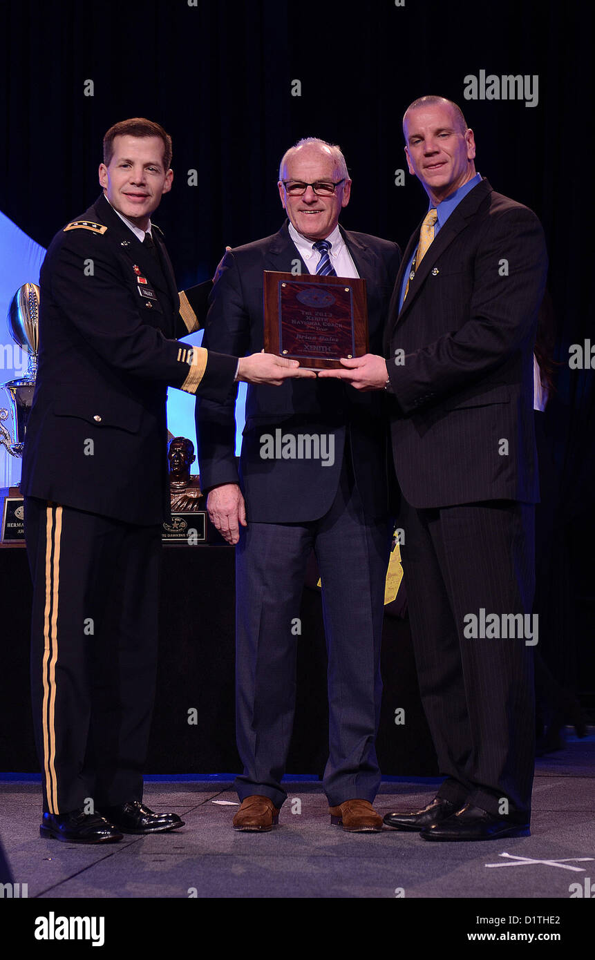 Lt. Gen. Jefferey Talley, Chief of the U.S. Army Reserve and commanding general of U.S. Army Reserve Command, gives the National Coach of the Year Award to Brian Hales at Marriott Rivercenter Hotel in San Antonio Jan. 4, 2013. (U.S. Army Reserve photo by Pfc. Victor Blanco, 205th Public Affairs Operations Center) Stock Photo