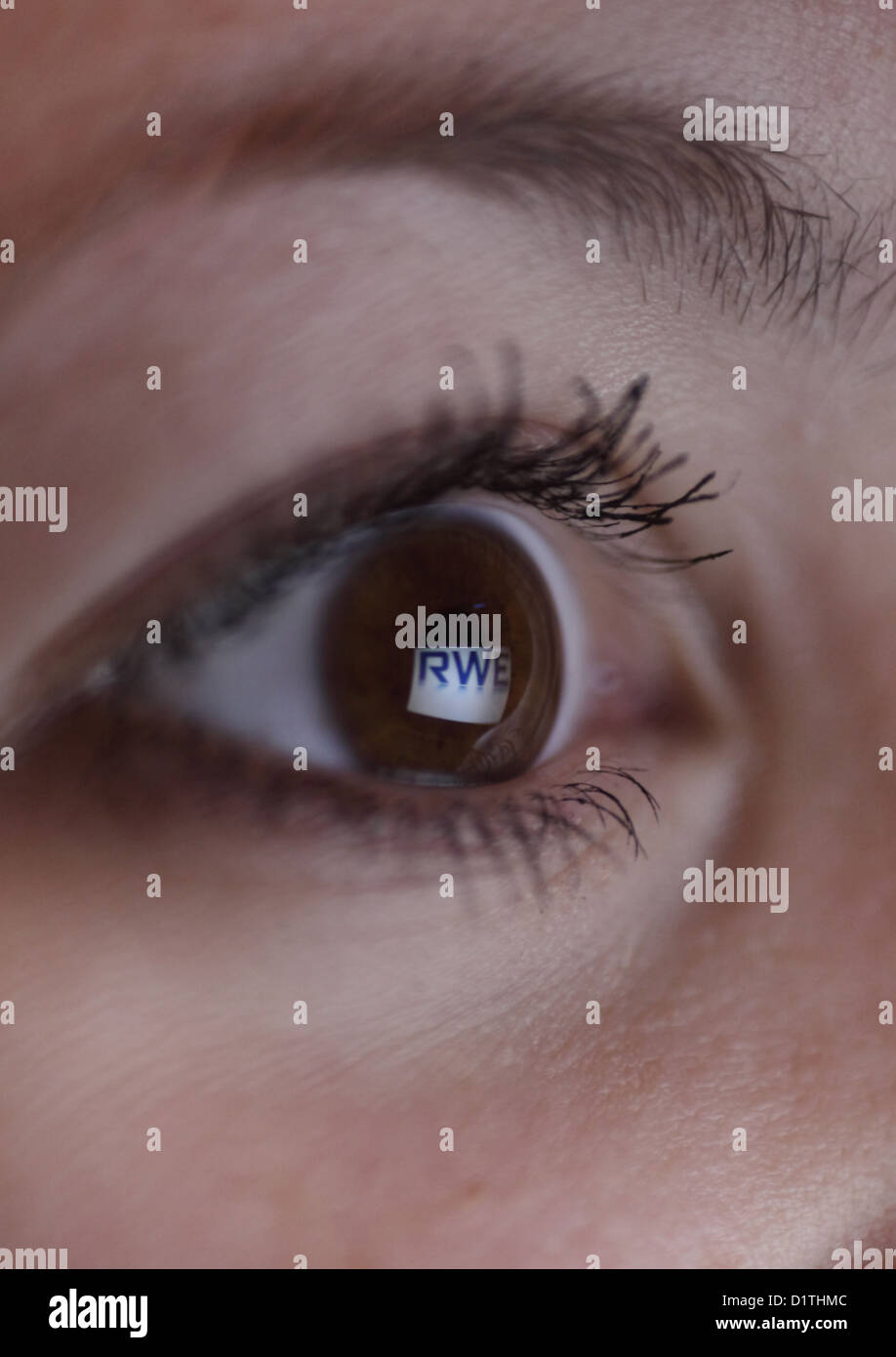 Berlin, Germany, mirroring the RWE logos in the eye of a woman Stock Photo