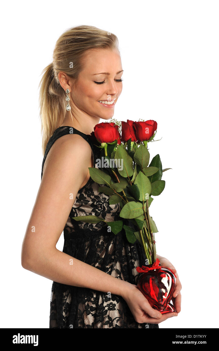 Portrait of beautiful young woman holding bouquet of red roses isolated ...