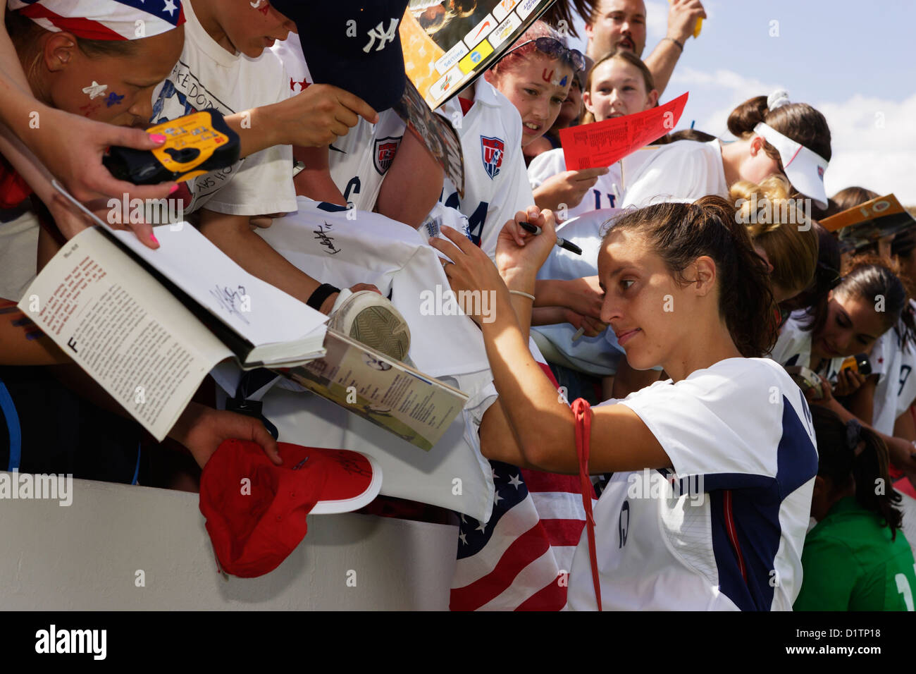 United States National Team soccer player Kate Markgraf signs autographs for young fans after a friendly match against Mexico. Stock Photo