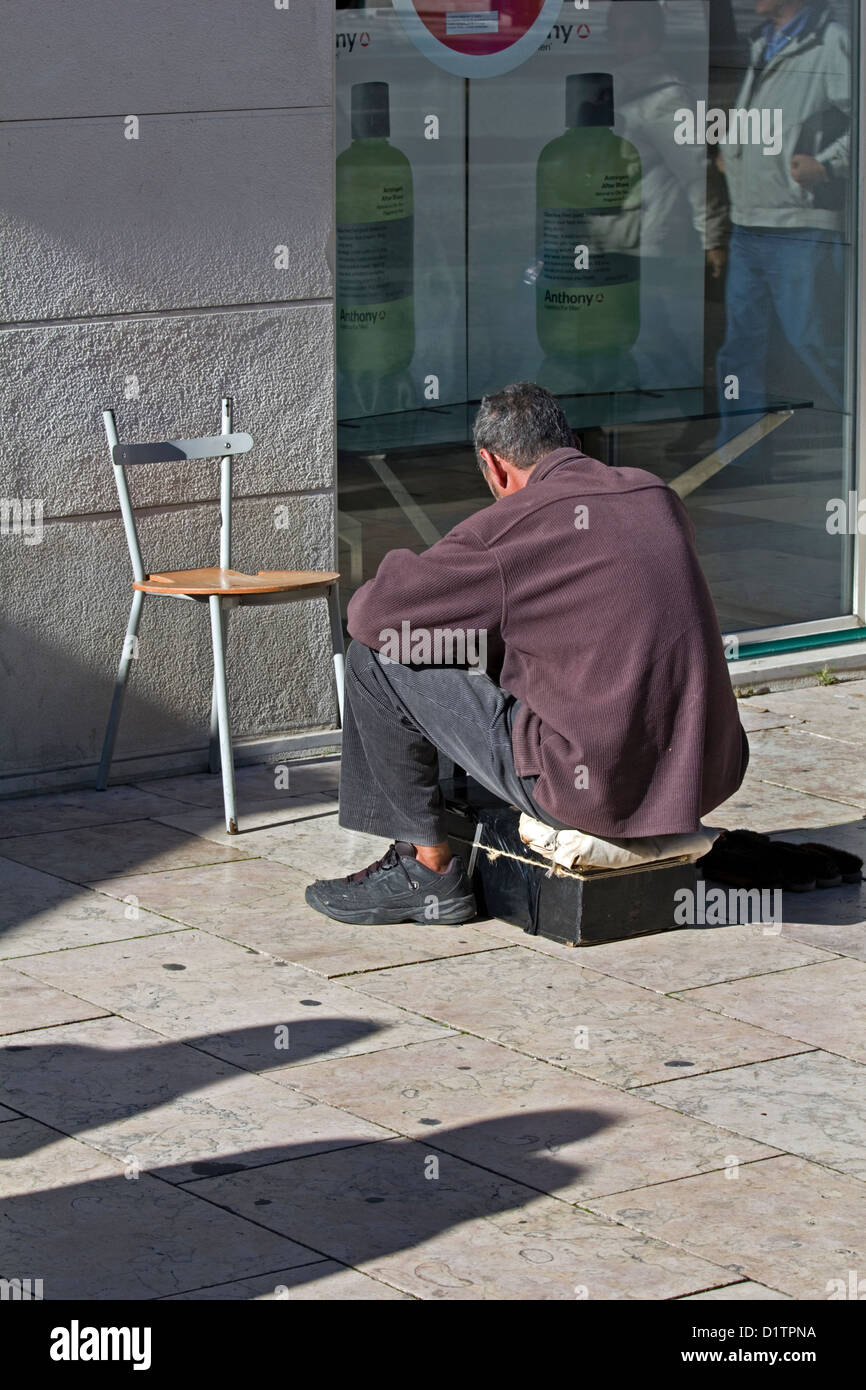 A shoe shine man without any customers on the streets of Lisbon, Portugal. Stock Photo