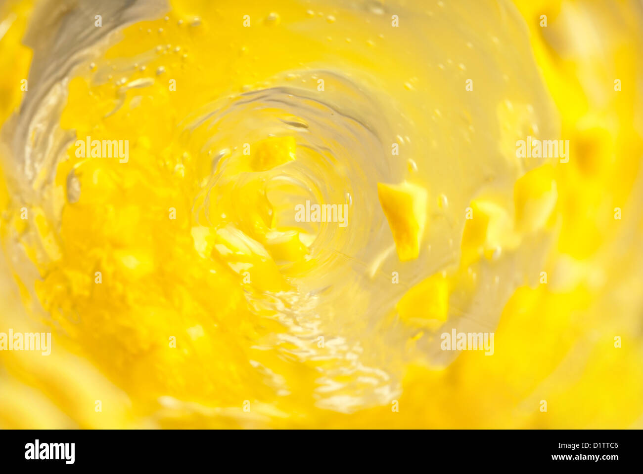 Inside bottle shot while pouring yellow juice Stock Photo Alamy