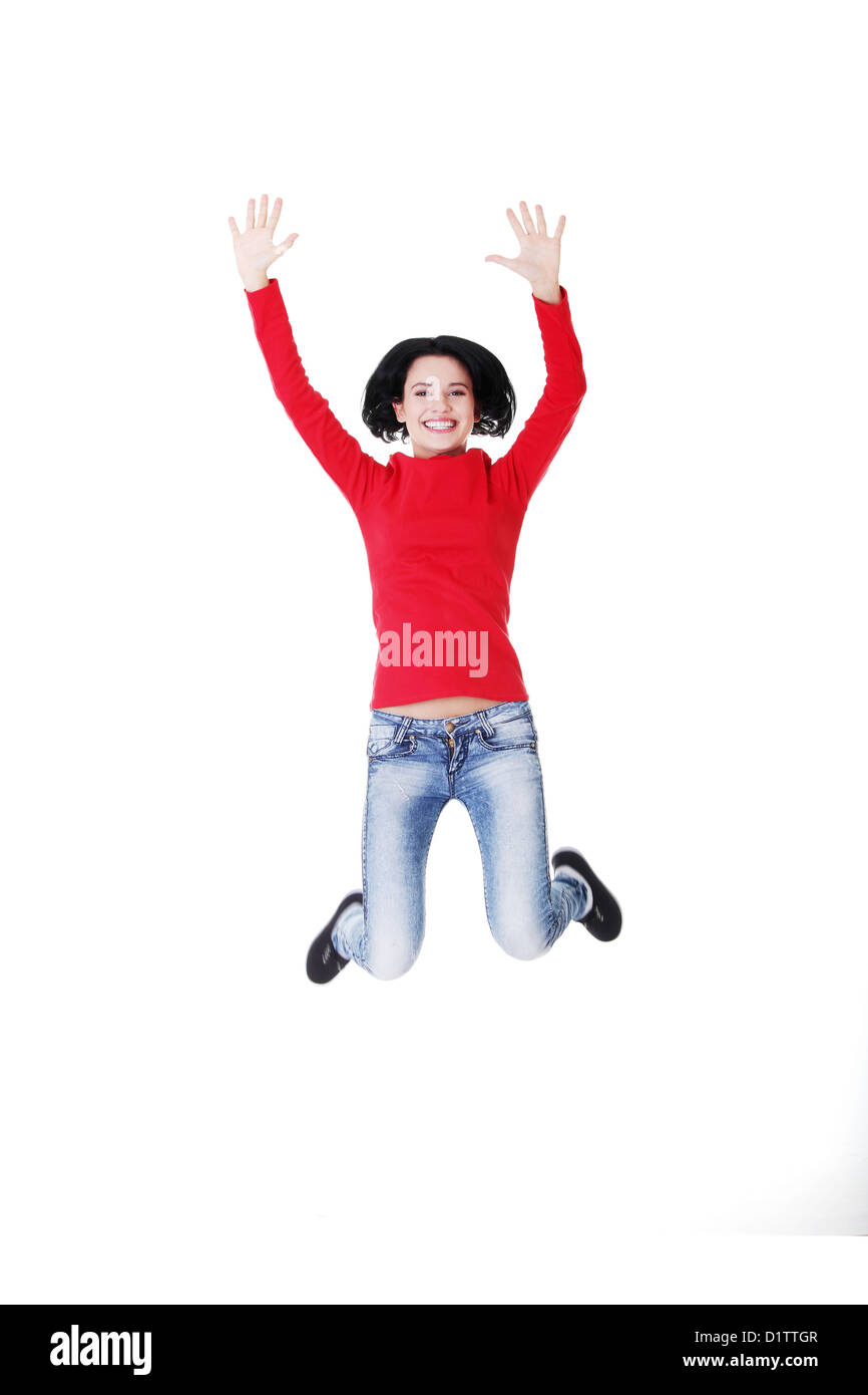 Young happy caucasian woman jumping in the air , isolated on white ...