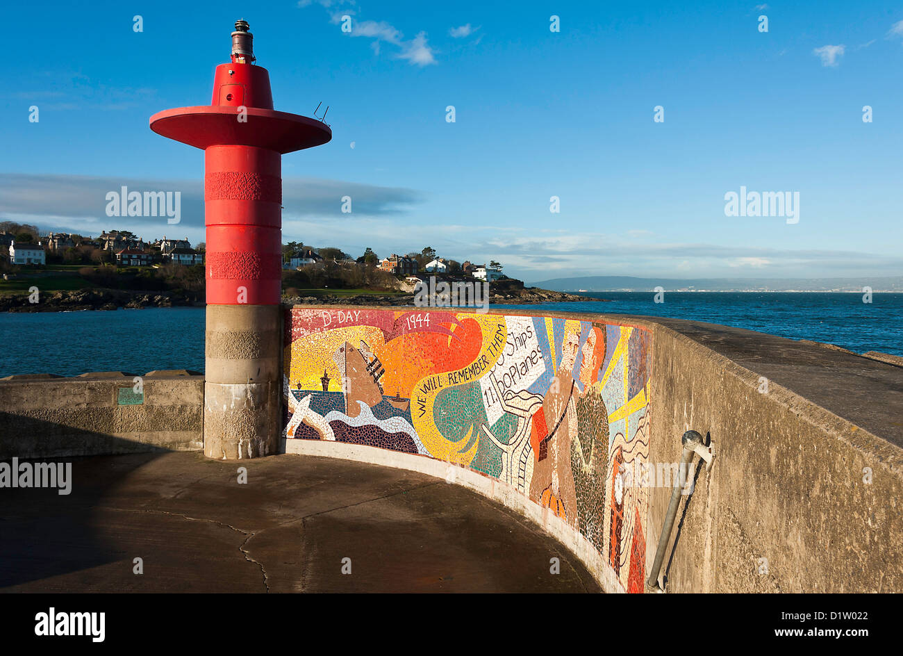 The Entrance to Bangor Harbour with Red Beacon Light and Memorial Mosaic on Seawall County Down Northern Ireland United Kingdom Stock Photo