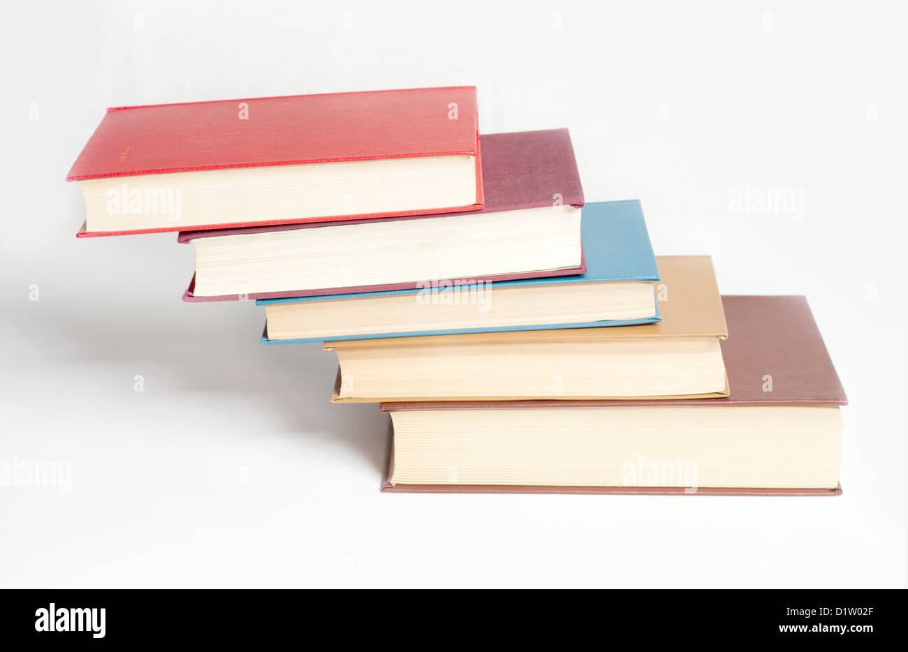Book heap isolated on white Stock Photo - Alamy