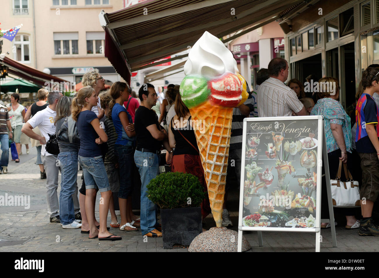 Echternach, Luxembourg, people come at an ice cream shop Stock Photo