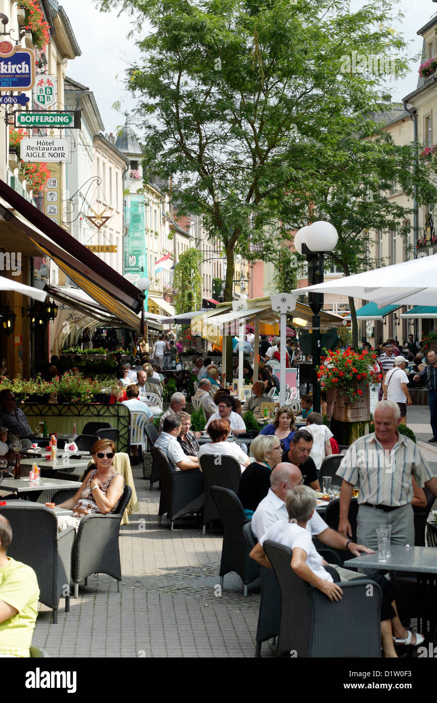 Echternach, Luxembourg, people are sitting in a street cafe in the pedestrian area Stock Photo