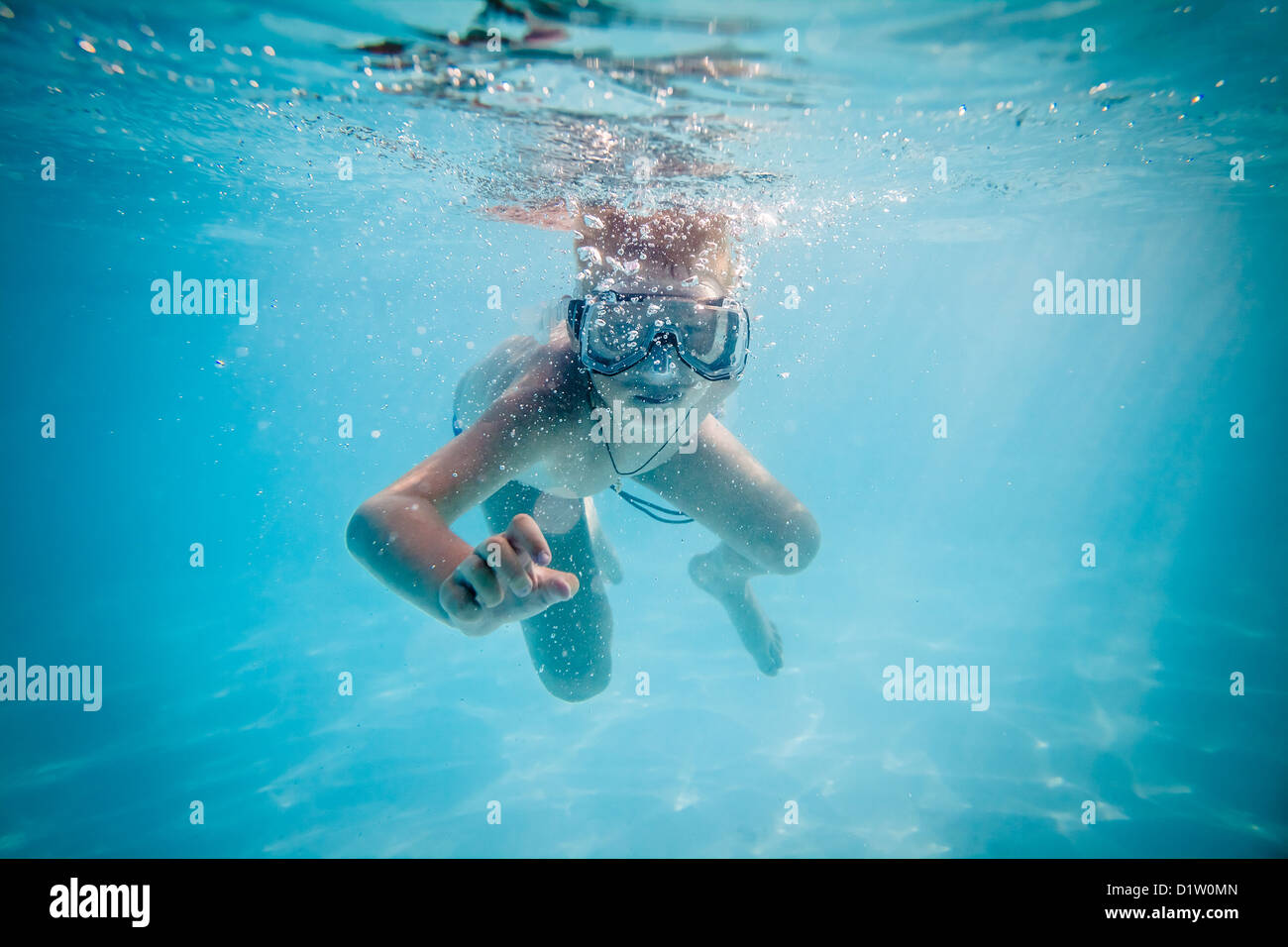 Boy swimming underwater in pool hi-res stock photography and images - Alamy
