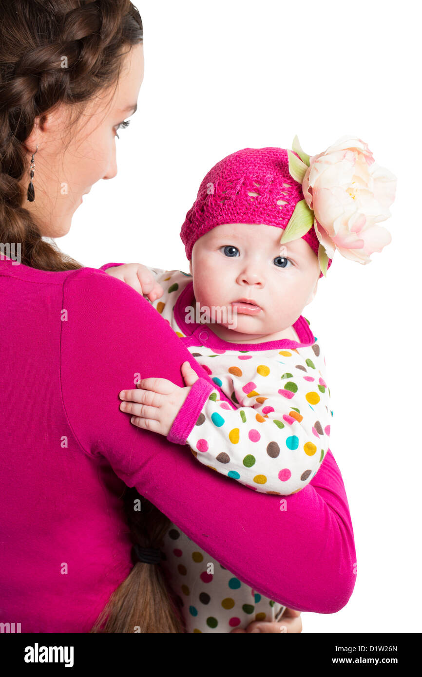 mother and baby girl on isolated white background Focus on child Stock Photo