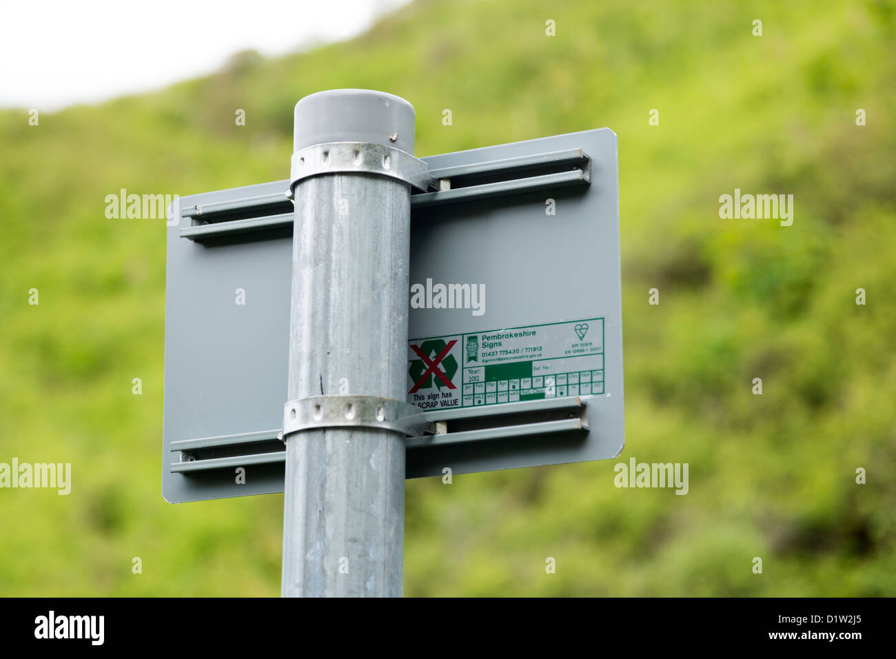 Llangrannog 2012 Metal road sign with anti theft warning Stock Photo