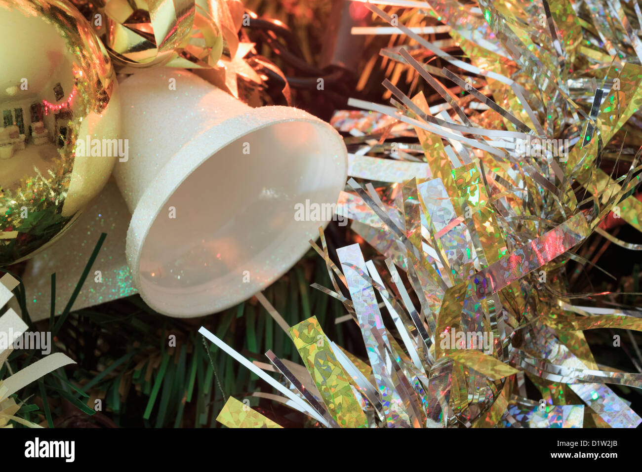 Bauble bells and silver tinsel decorations on a Christmas tree Stock ...