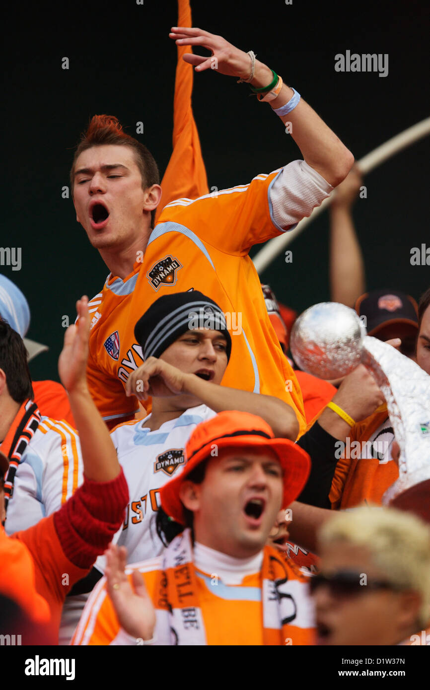 Houston Dynamo supporters cheer for their team at the MLS Cup championship soccer match against the New England Revolution. Stock Photo