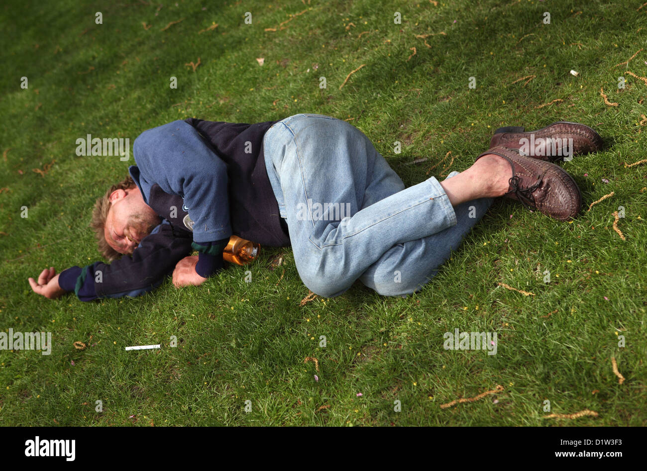 Budapest, Hungary, symbol poverty. A man is sleeping on the grass Stock Photo