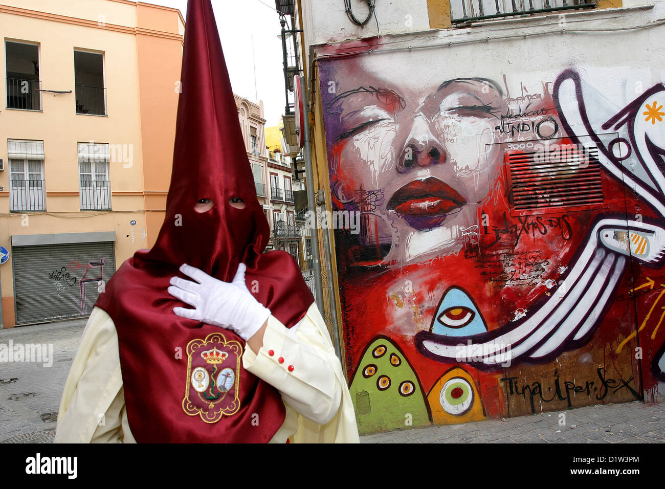 Semana Santa (Holy Week), Fiesta. Celebration in the streets of the old city center of Seville. Andalucia, Southern Spain street art graffiti Stock Photo