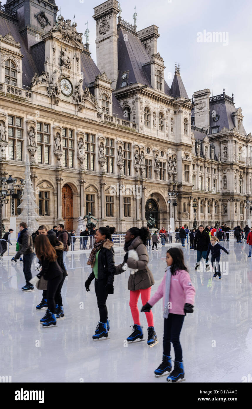 Paris, France. Young people ice skating in front of the Hotel de Ville