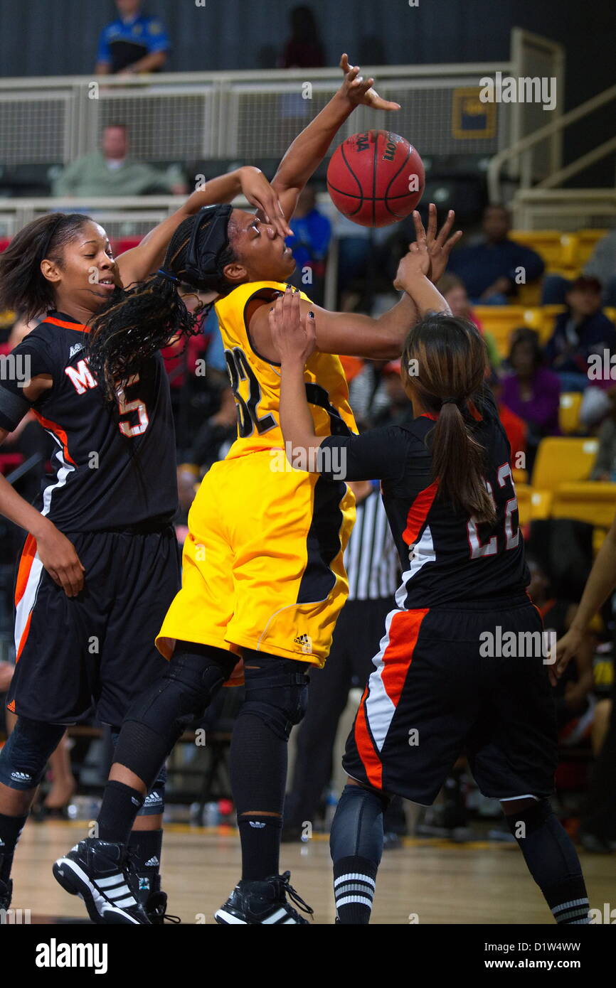 KSU's Sametria Gideon (32) is fouled while shooting by Sharmesia Smith (5) during Mercer's 71-46 victory over Kennesaw State.  Kennesaw, Georgia. USA. January 5, 2013.   NCAA Division I Atlantic Sun Conference women's college basketball. Stock Photo