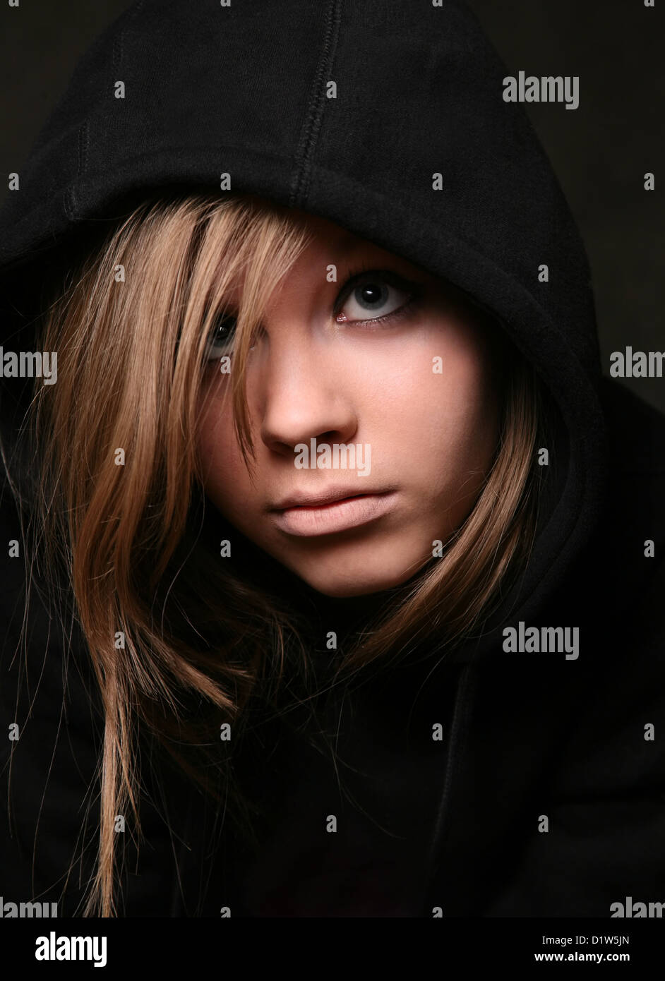 Portrait of the young girl in a black hood Stock Photo - Alamy