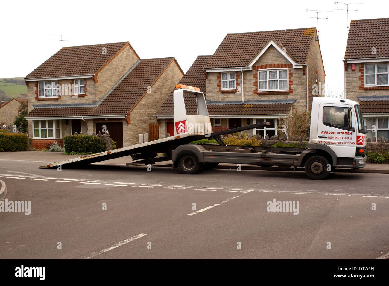 Truck car carrier with it's back off ready to load a car. Stock Photo