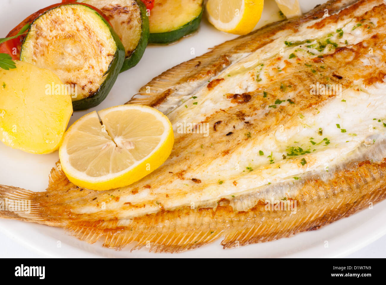 Grilled sole served with vegetables, a very Mediterranean recipe Stock