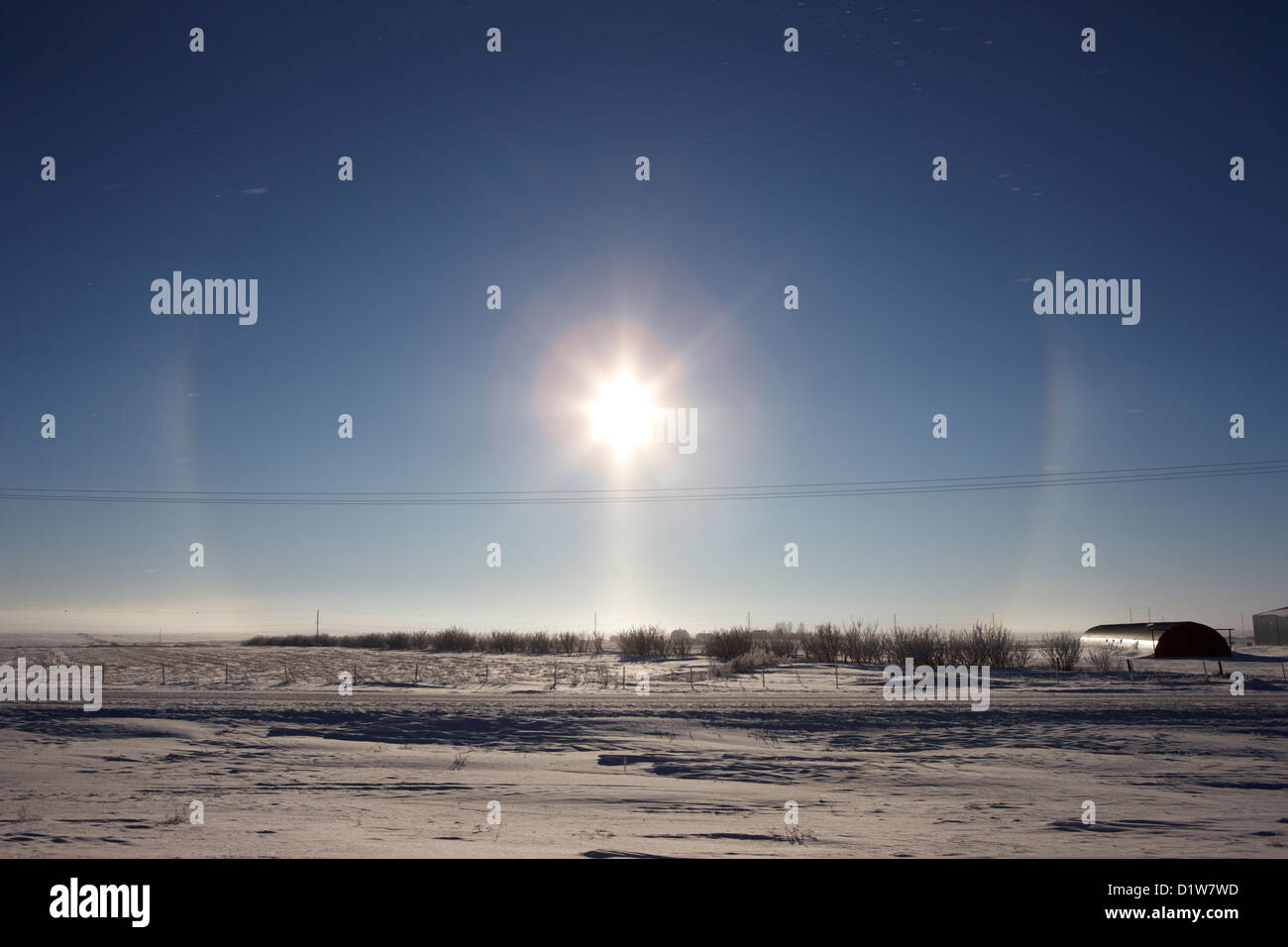 sun dog parhelion halo due to ice crystals surrounding the sun in Saskatchewan Canada Stock Photo