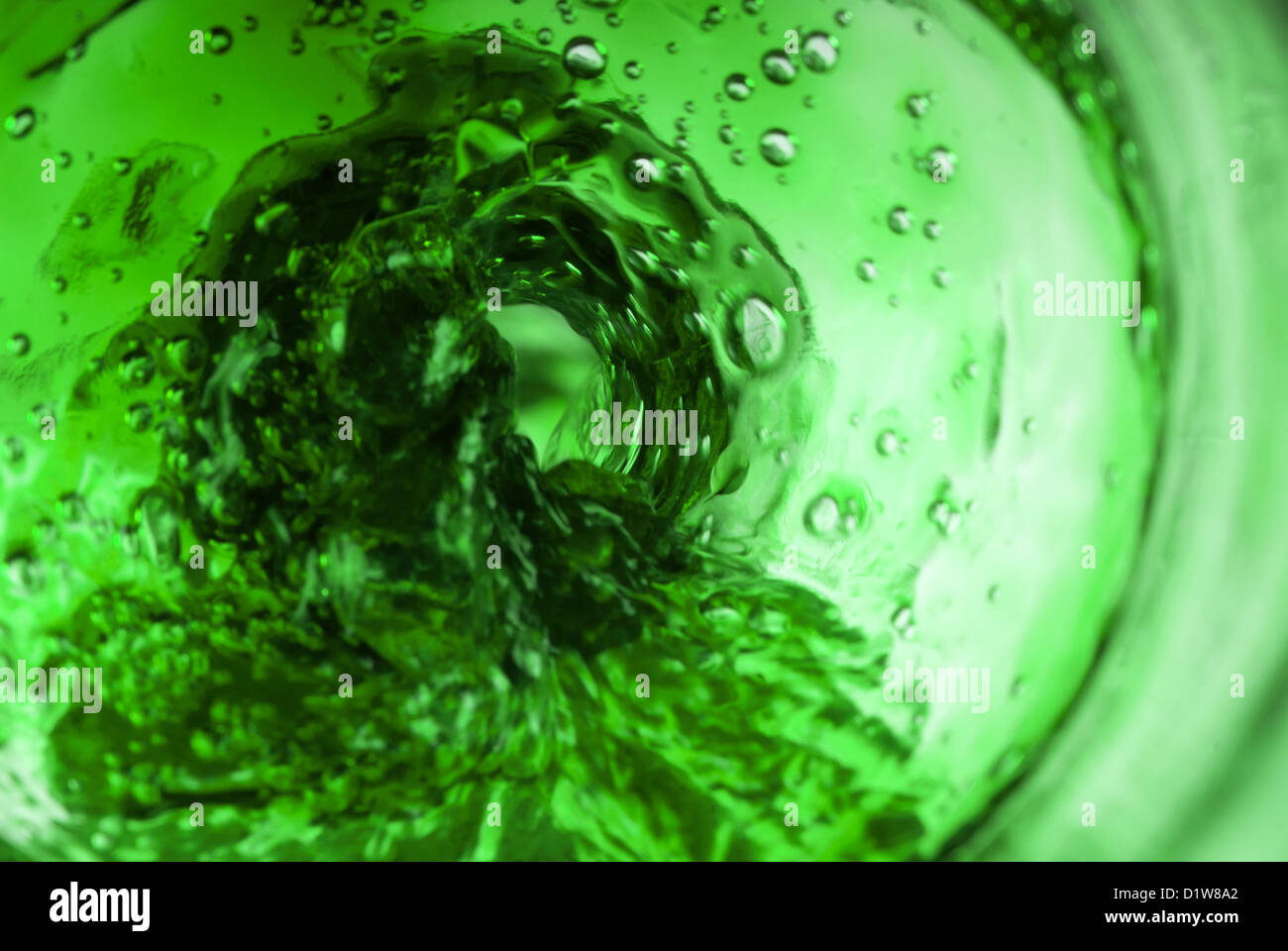 Green vortex inside bottle pouring liquid Stock Photo Alamy