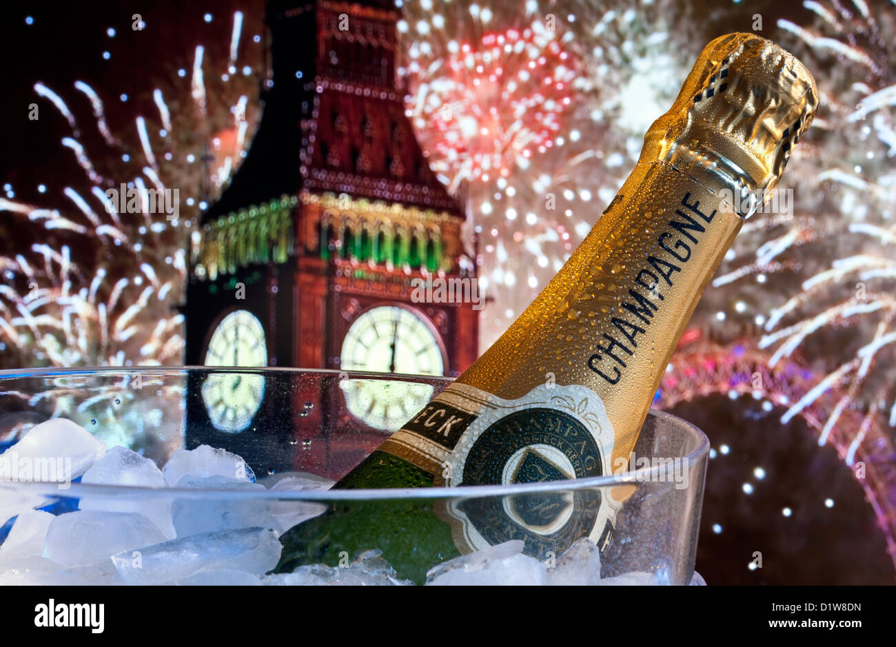 Bottle of champagne on ice in wine cooler with Big Ben and London Eye behind at midnight with big celebration party fireworks Stock Photo
