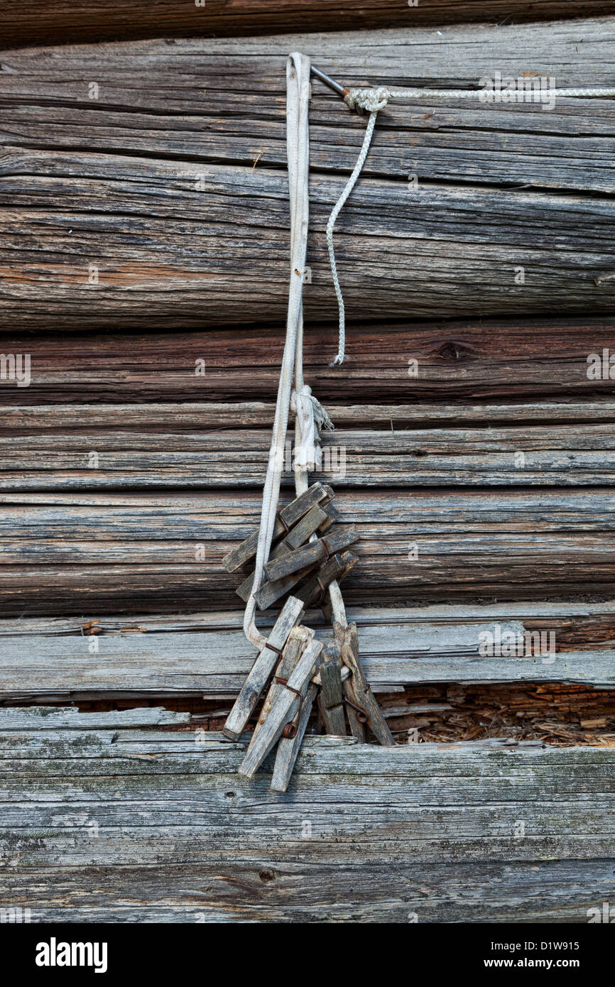 Old wooden clothespin on the rope Stock Photo