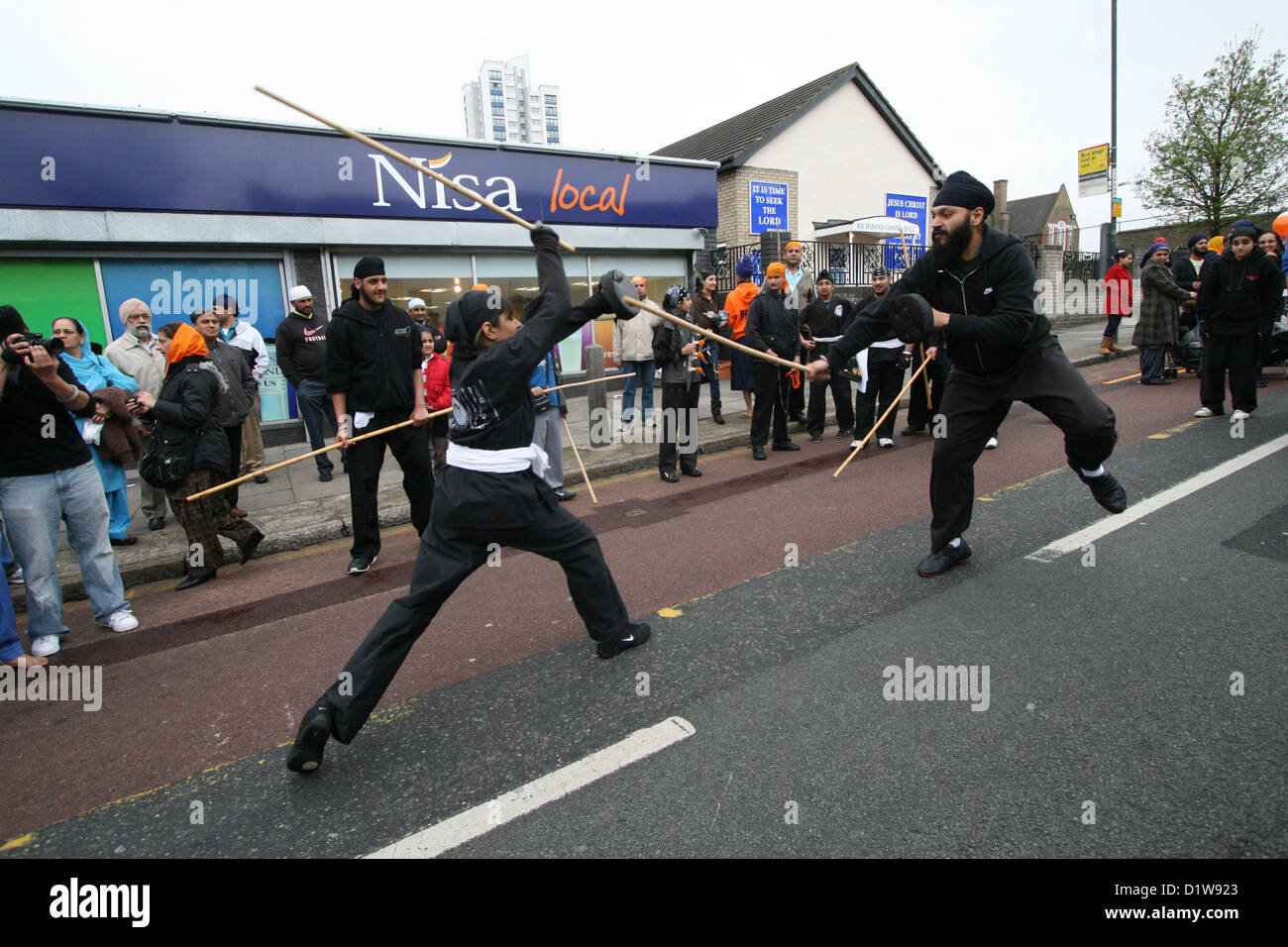Two young Sikhs showing their martial skills during Vaisakhi celebration in London Stock Photo