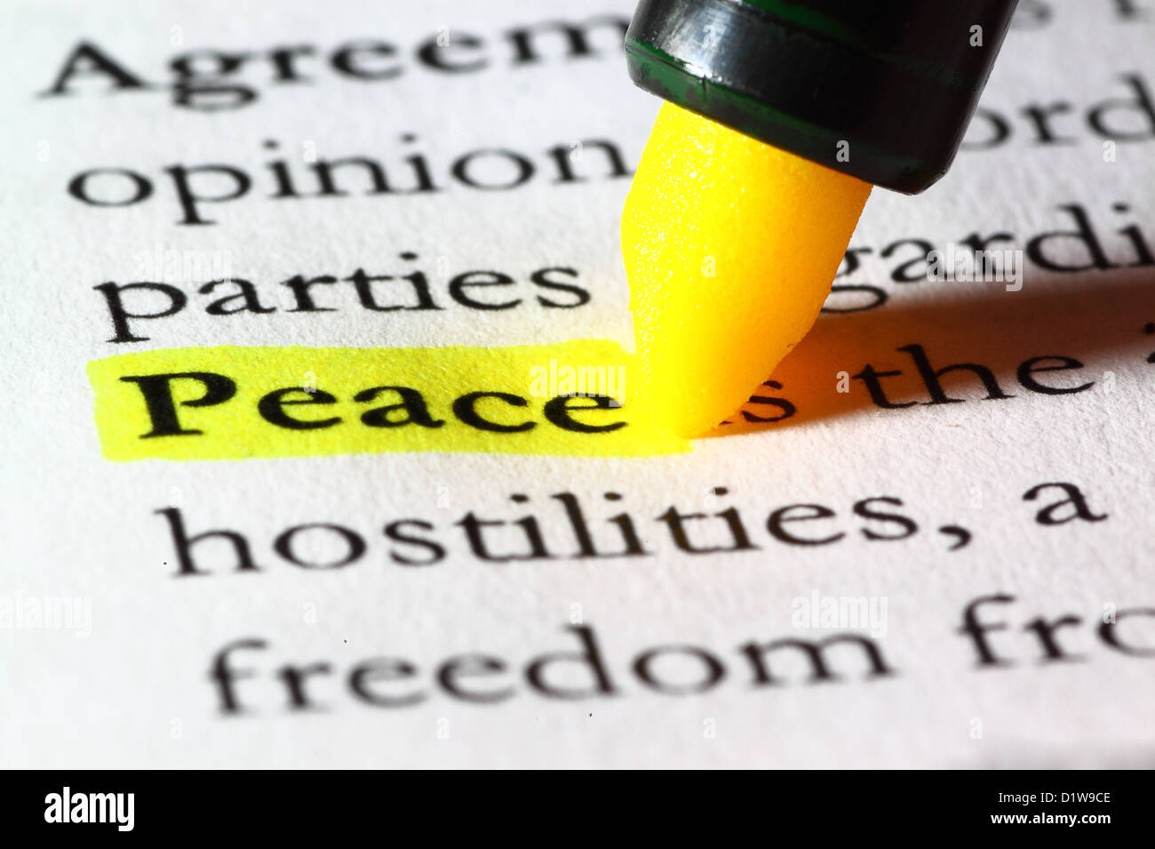 Word peace highlighted with a yellow marker Stock Photo