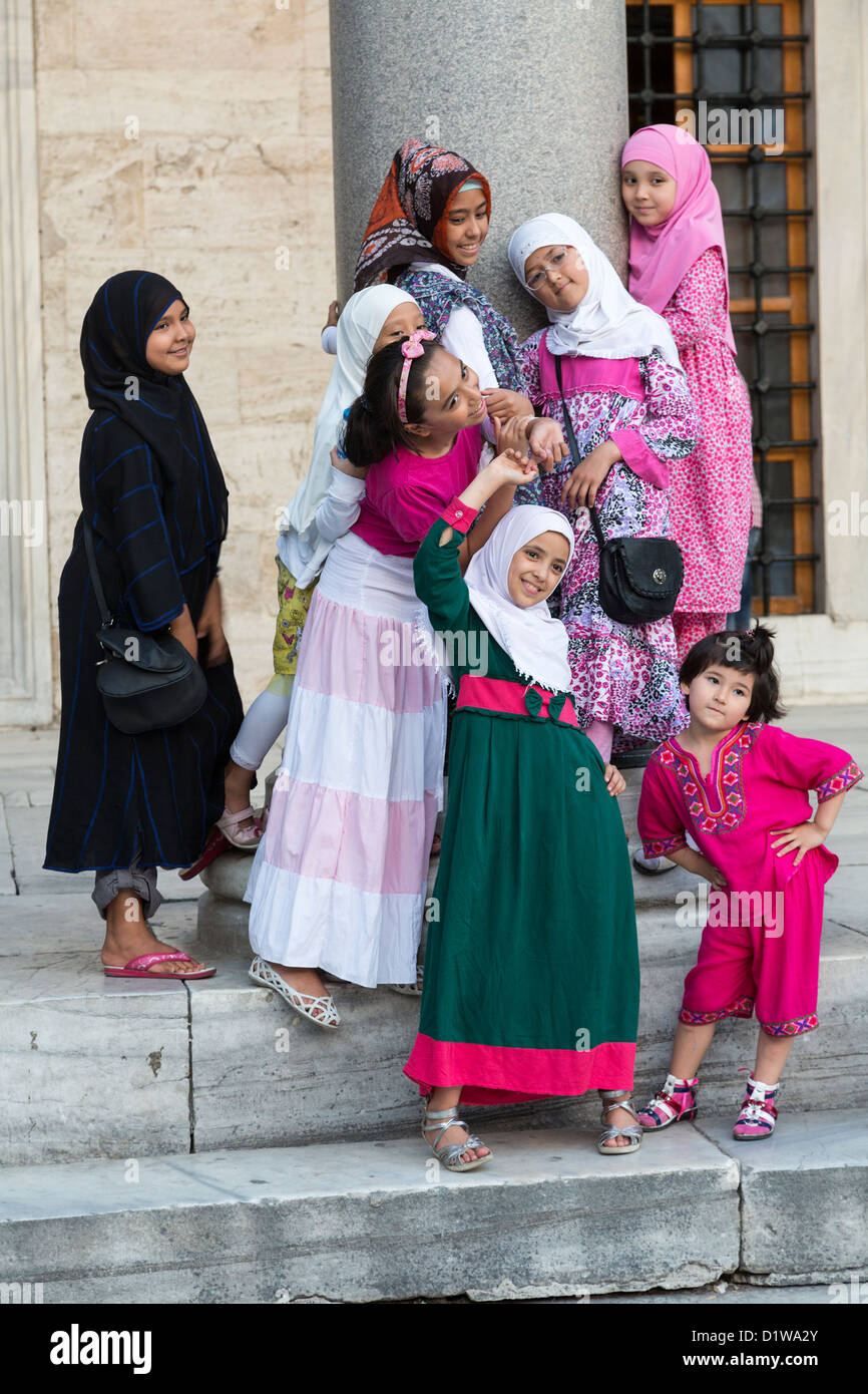 Muslim family posing for photograph, Sultan Ahmet Mosque, Istanbul, Turkey Stock Photo