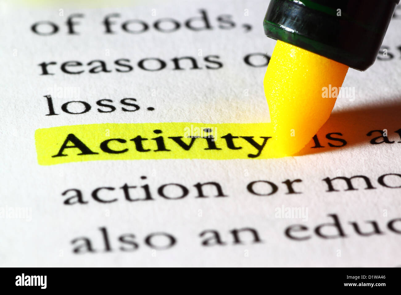 Word activity highlighted with a yellow marker Stock Photo