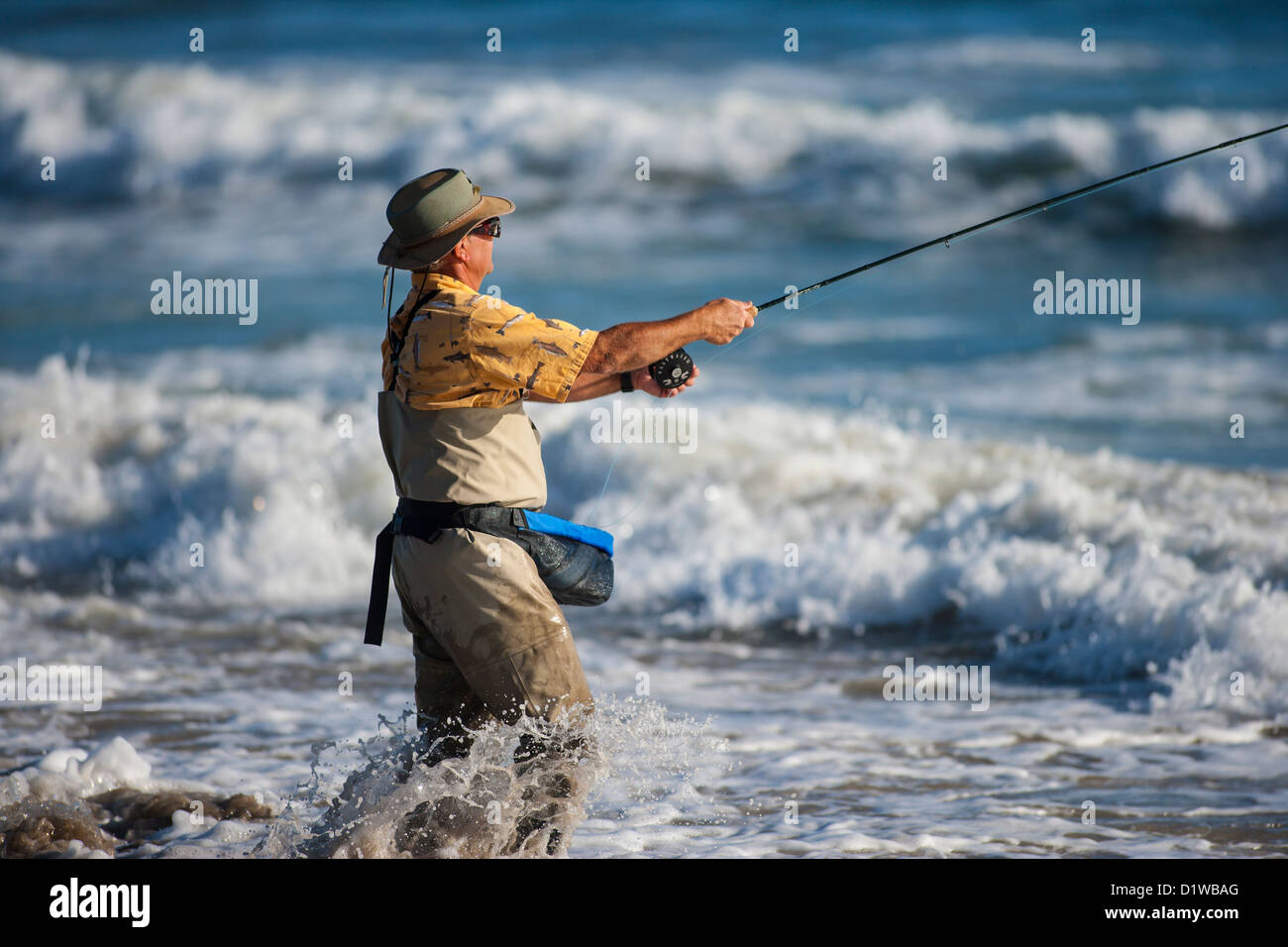 fly fisherman casting for surf perch, La Conchita Beach near Carpinteria, California, United States of America Stock Photo