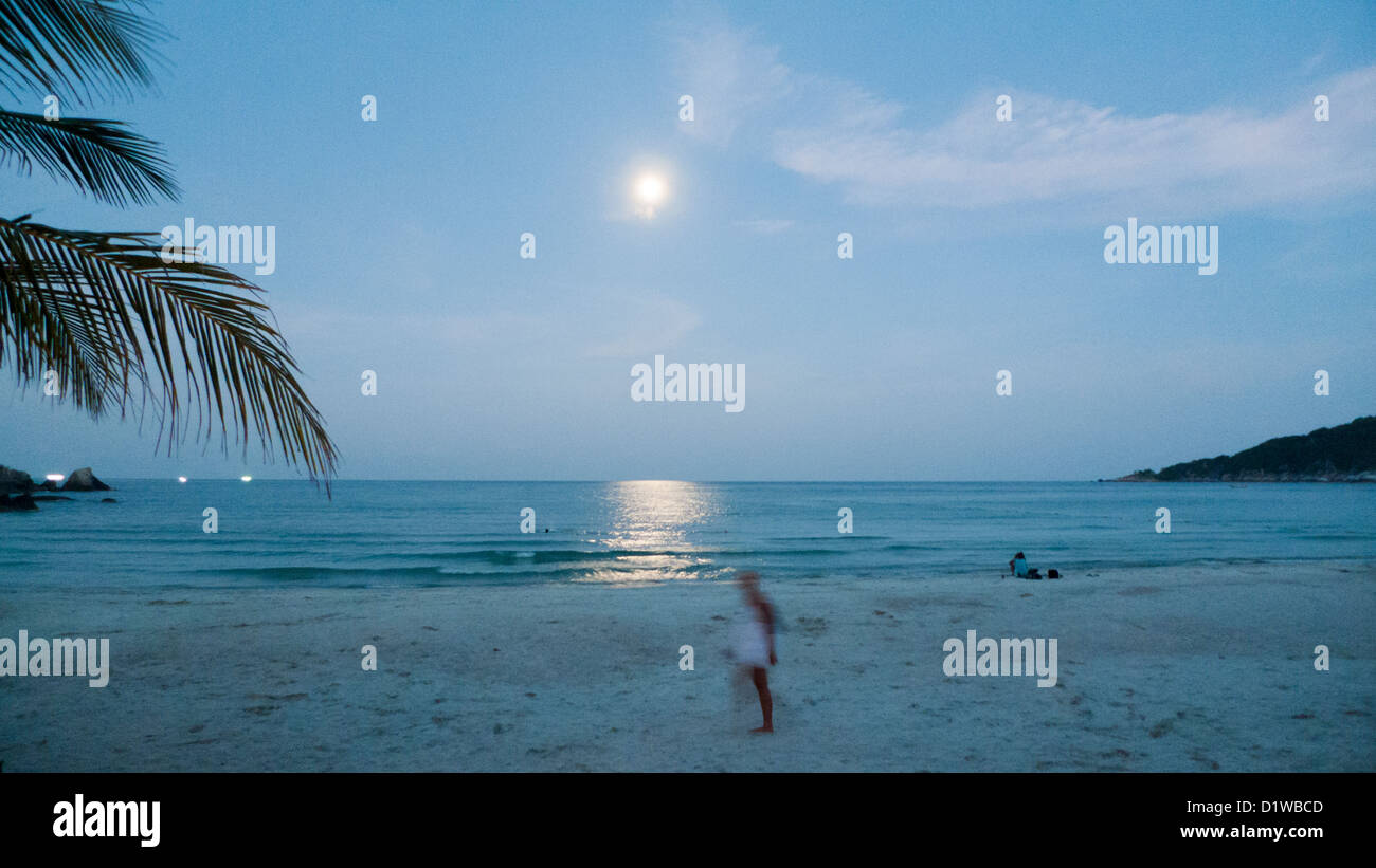 full moon night in Haad Rin beach of Koh Phangan, Thailand. Stock Photo