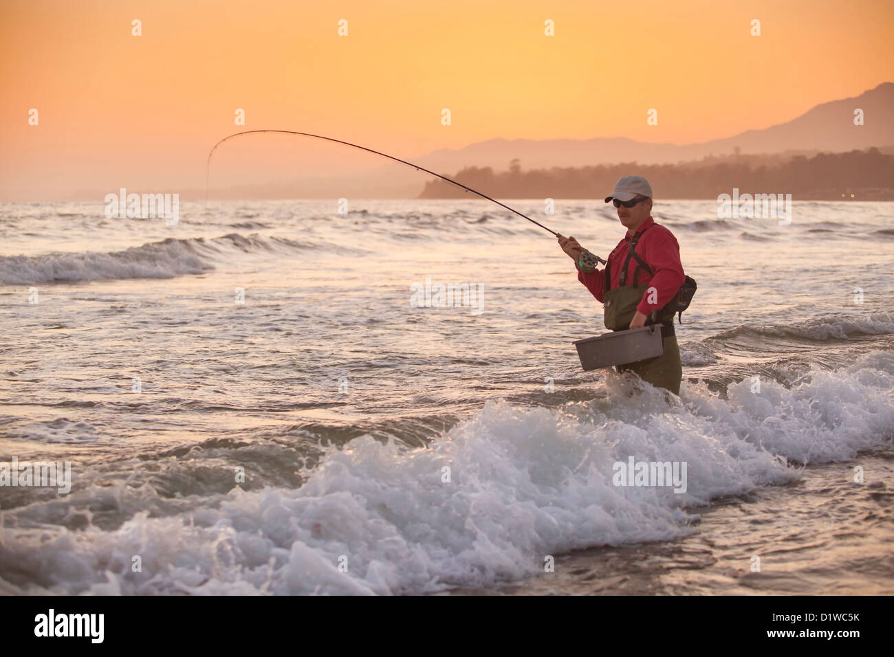 fly fishing for perch in the surf at Padaro Beach, Carpinteria, California, United States of America Stock Photo