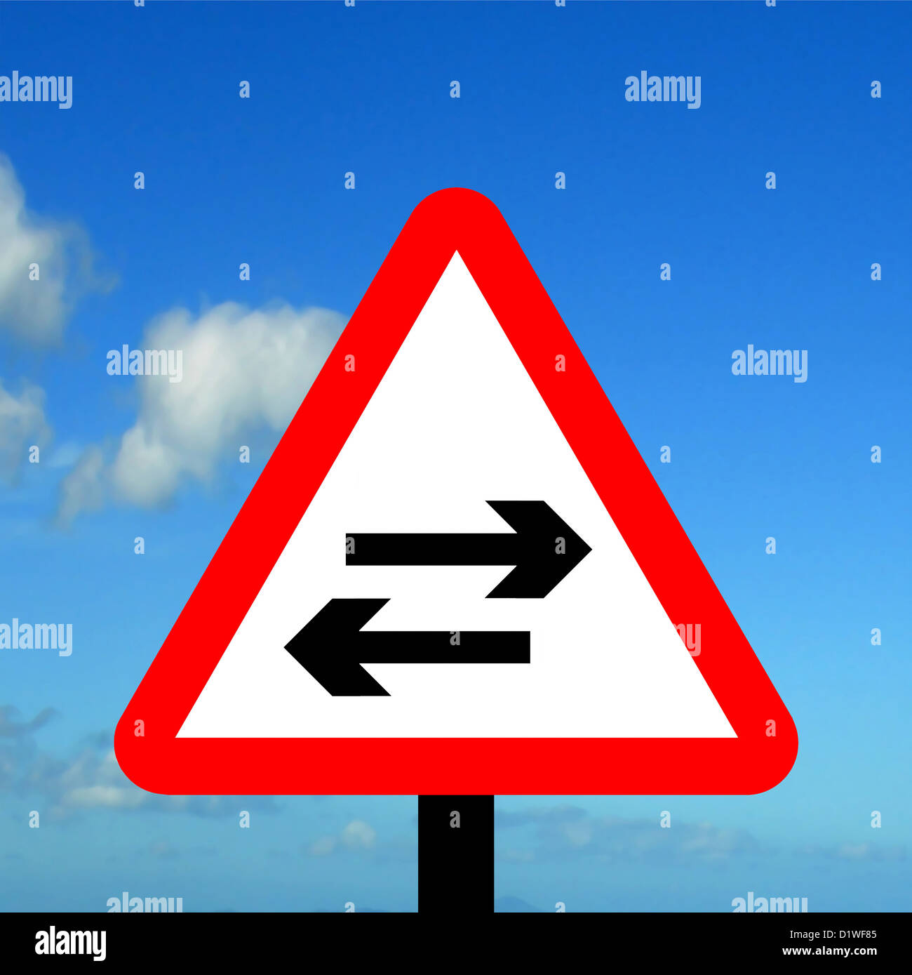 warning triangle two way traffic crosses one-way road Stock Photo