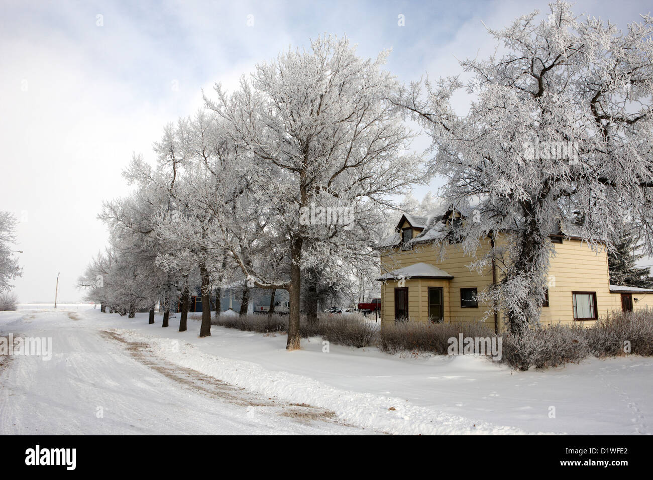 snow covered street in small rural farming community village Forget Saskatchewan Canada Stock Photo