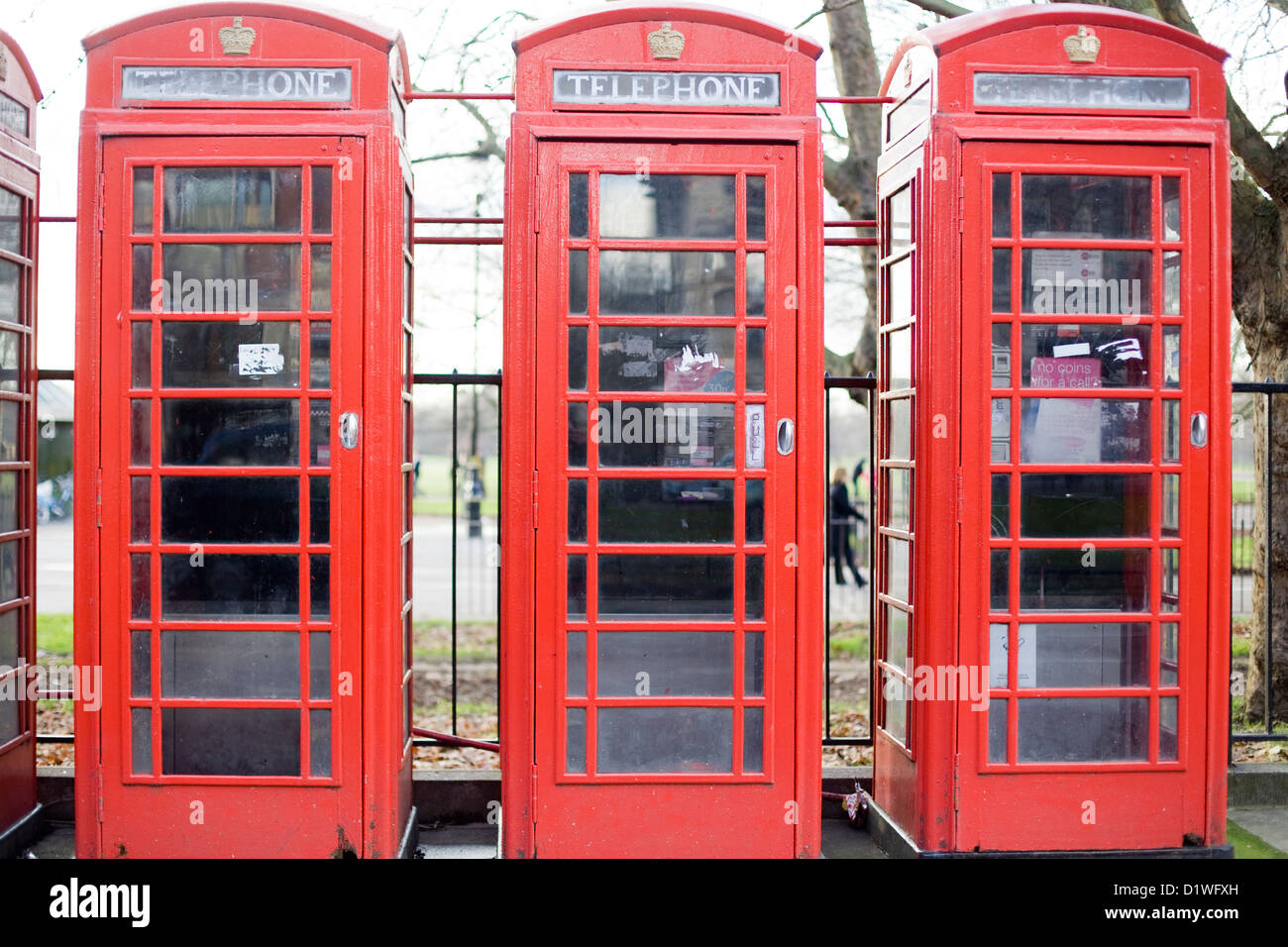 Three Red Telephone boxes in a row Stock Photo