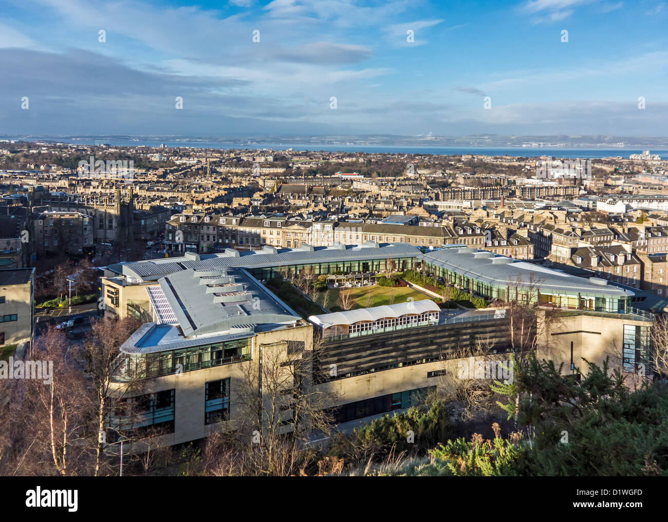 Roof garden on top of the OMNI building in Leith Street Edinburgh Scotland viewed from Calton Hill with distant Firth of Forth Stock Photo
