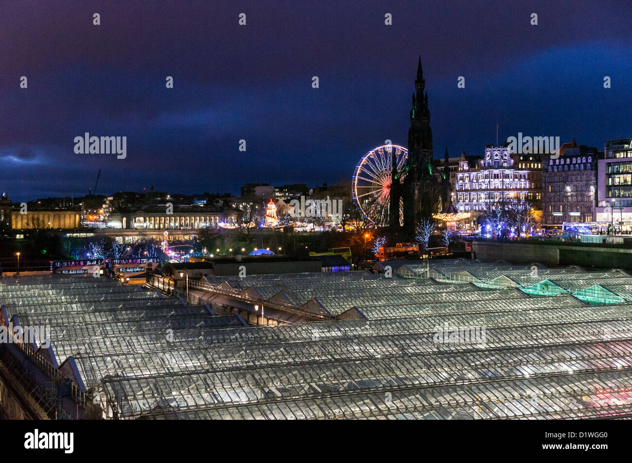 Night view of the new glass roof on Waverley Railway Station in Edinburgh Scotland with Xmas entertainment lights Stock Photo