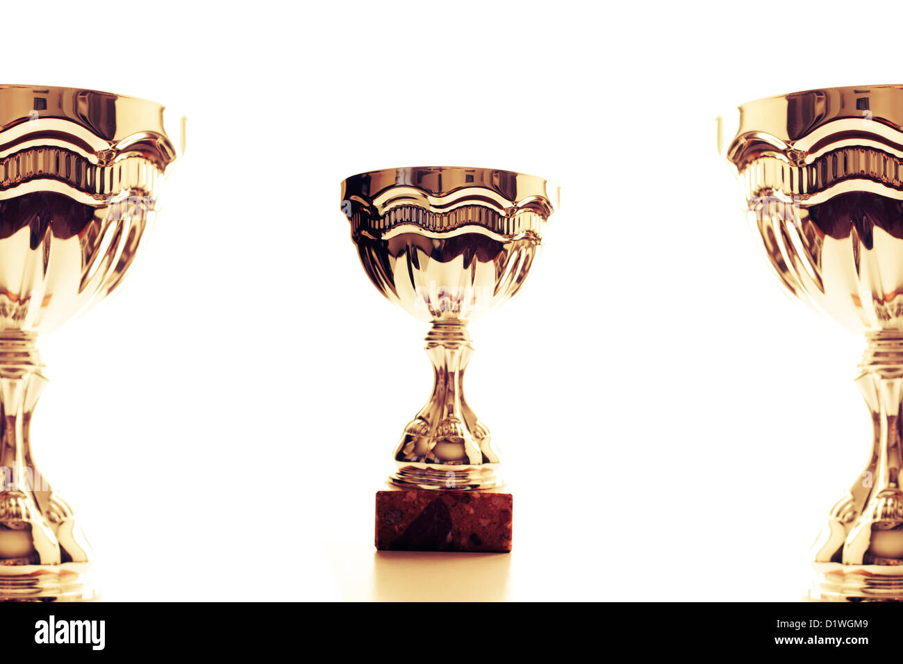 Golden trophies on white background Stock Photo - Alamy