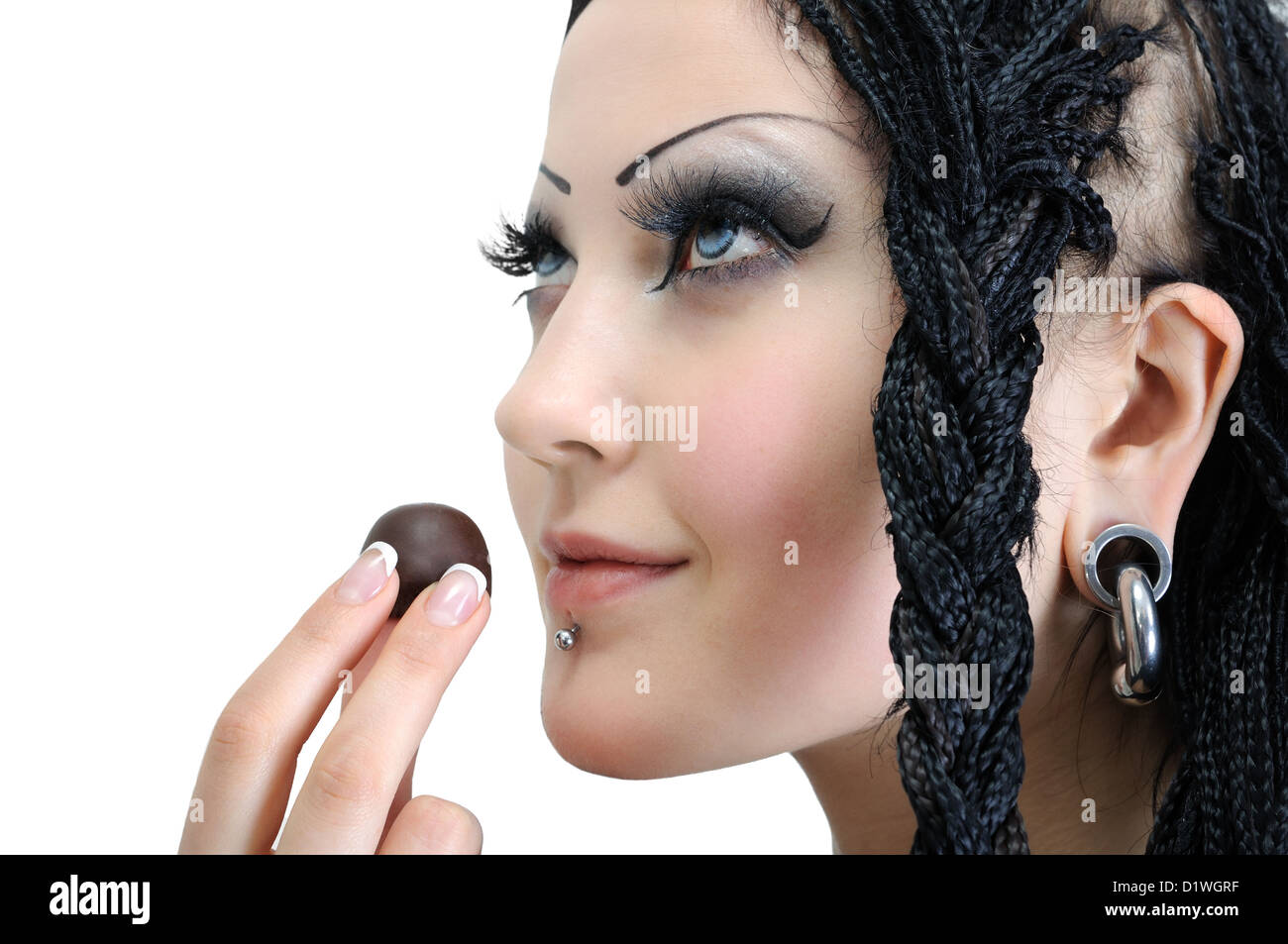 Young Stylish Woman With Dreadlocks Holding Chocolate Candy