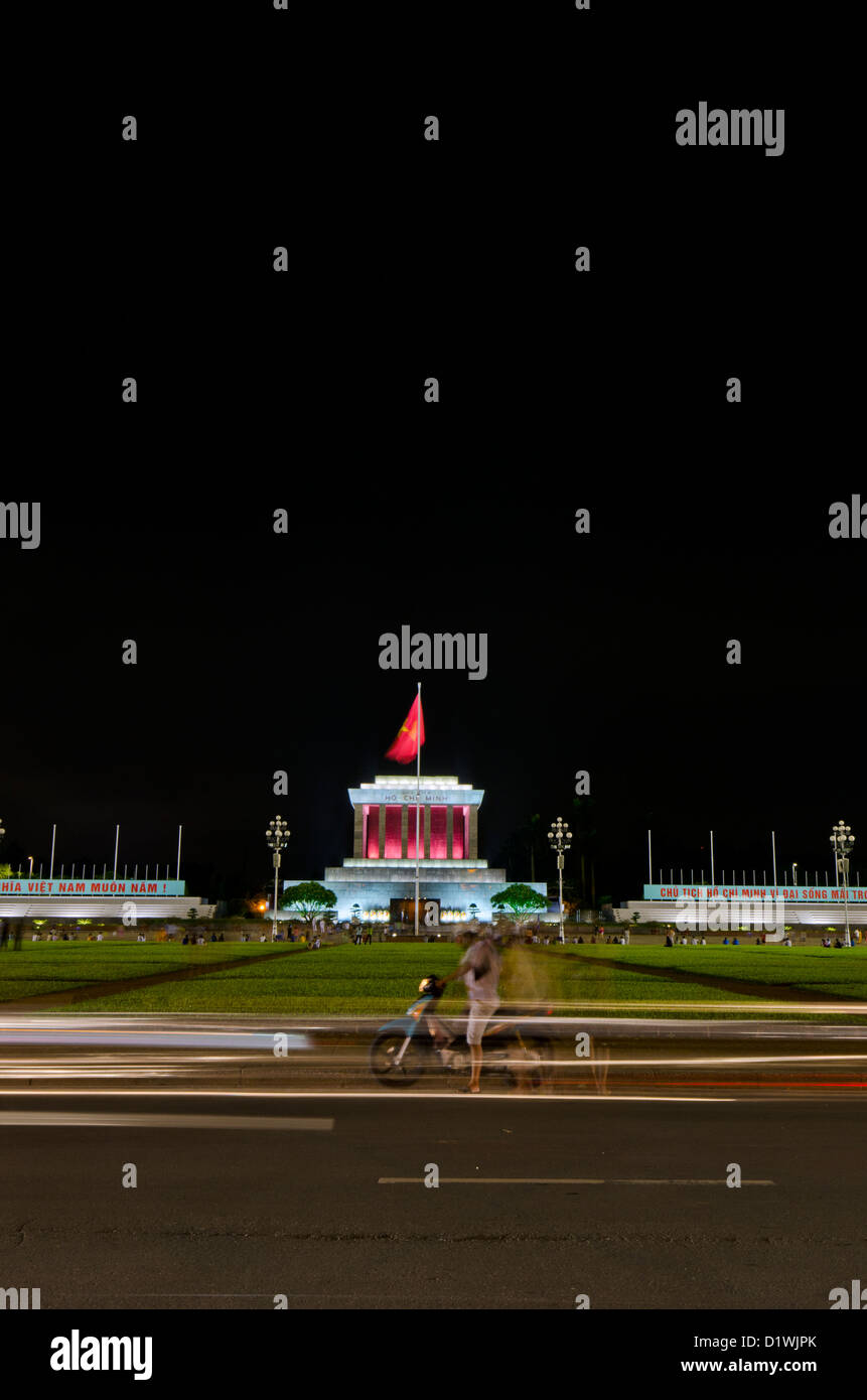 Ho Chi Minhs Mausoleum, Ho Chi Minh City, at Night with Passing Motorbike Stock Photo