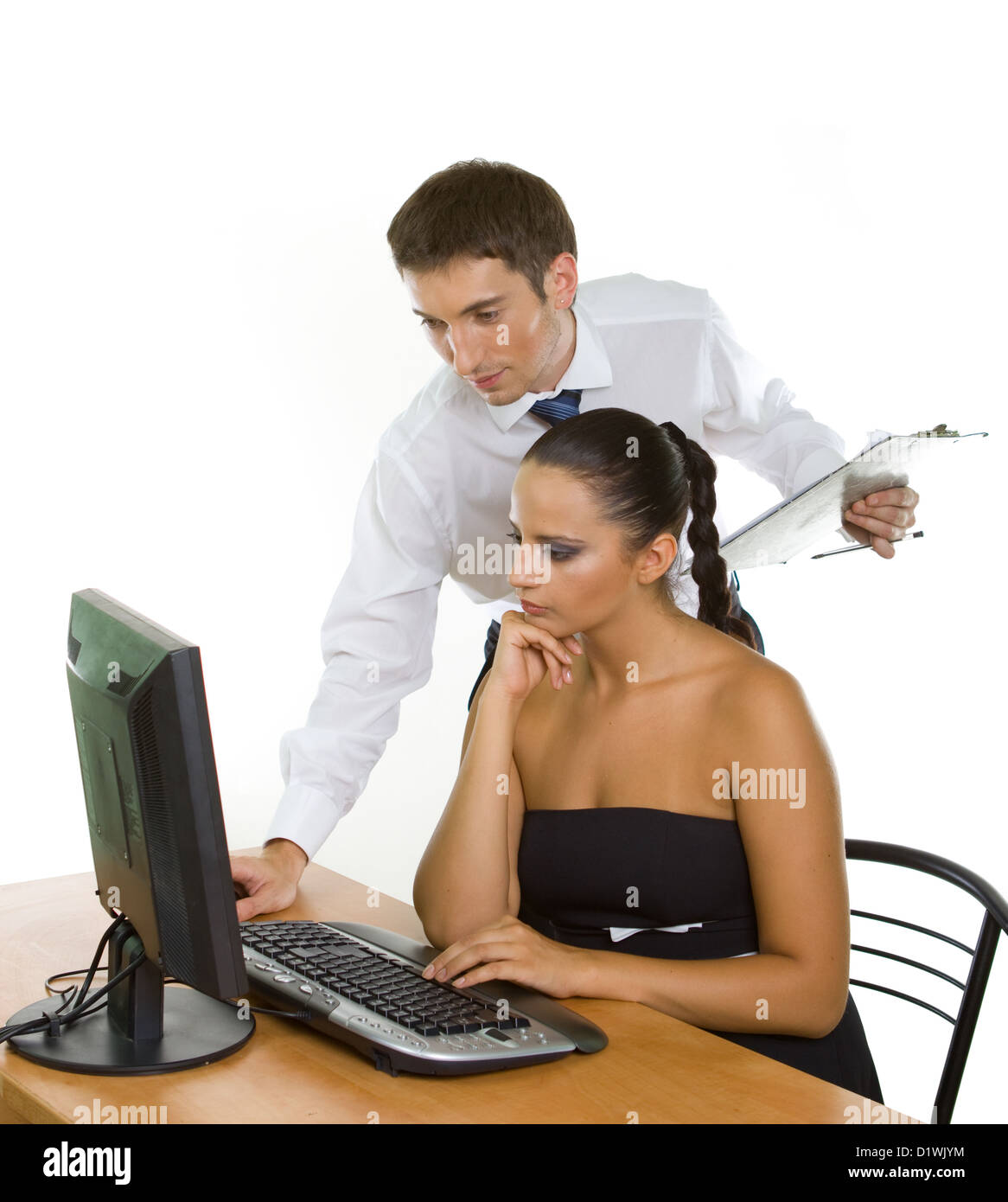 Two contemporary businesspeople discussing while working at the ...