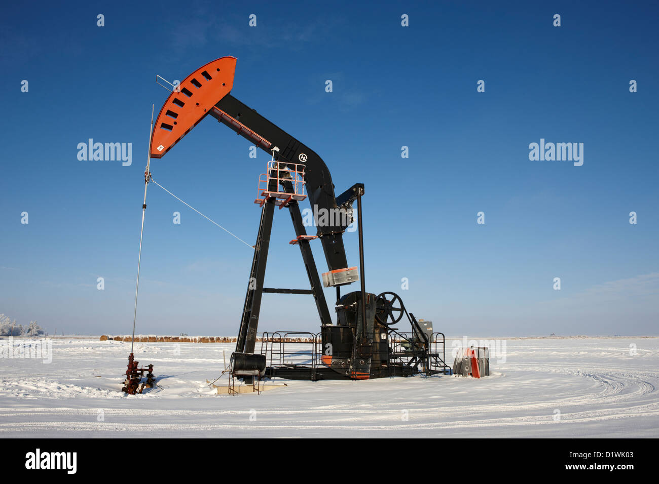 oil pumpjack in winter snow Forget Saskatchewan Canada Stock Photo