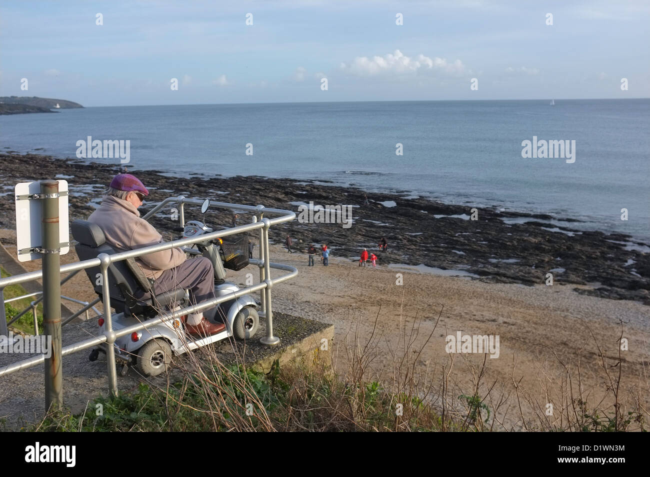 An old-age pensioner on the seafront of Falmouth, Cornwall, UK Stock Photo