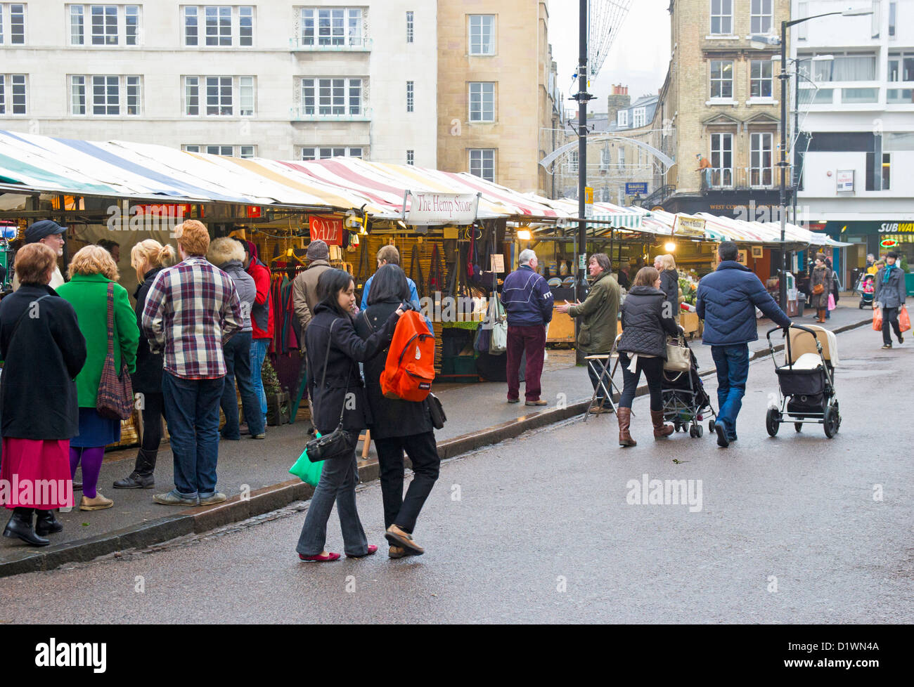 Cambridge Market stalls and shoppers in winter. Stock Photo