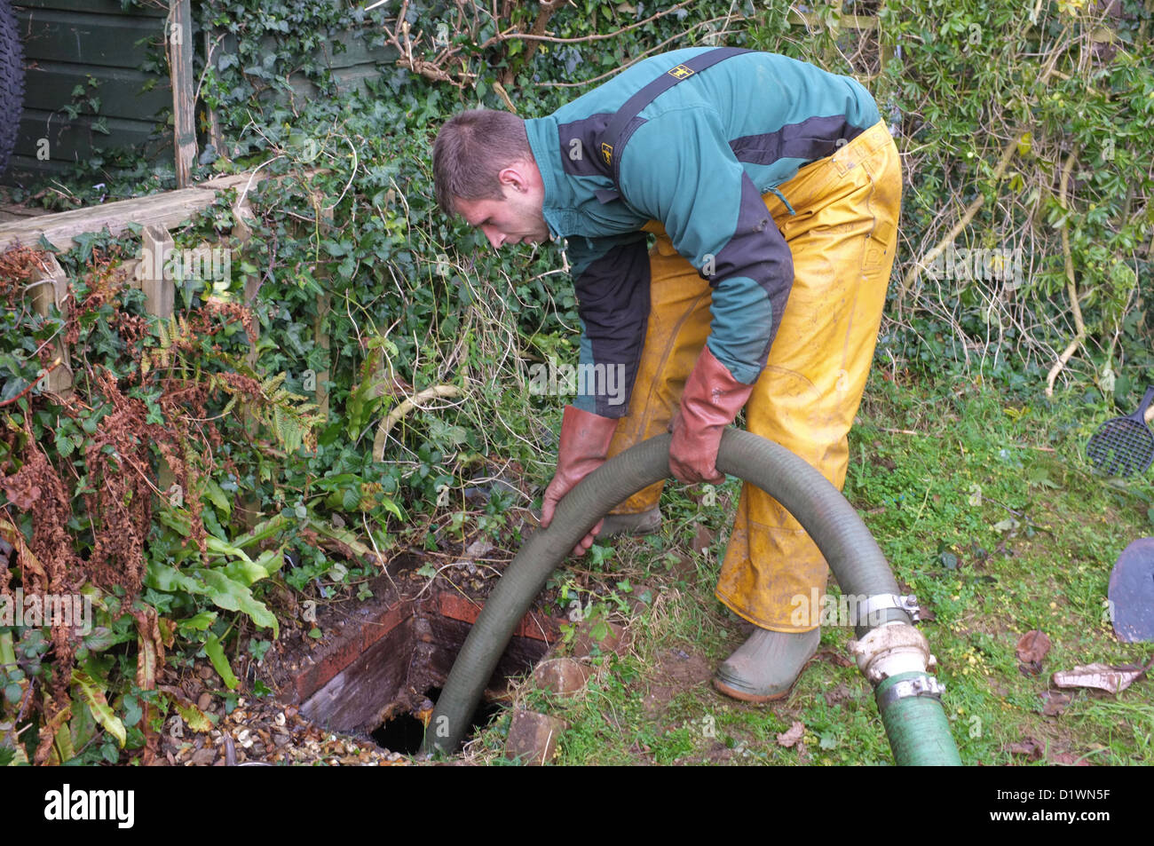 A septic tank being cleared Stock Photo