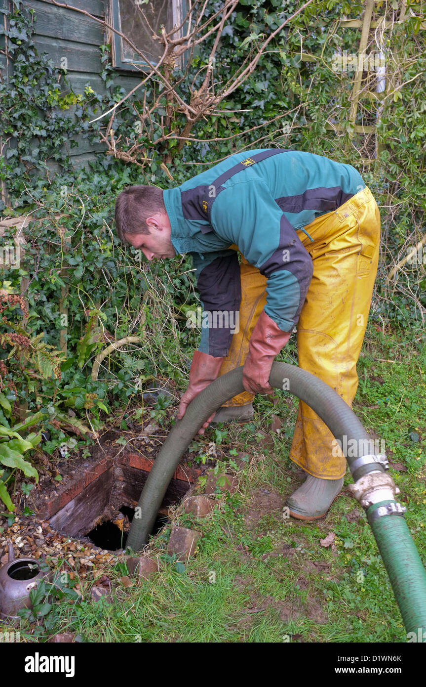A septic tank being cleared Stock Photo