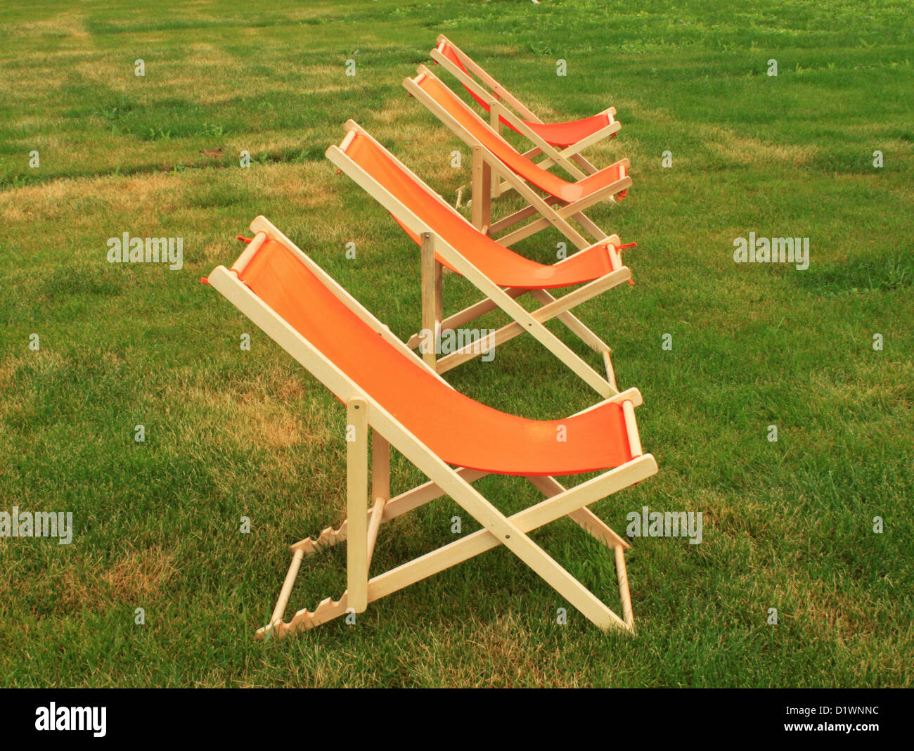 Chaise lounge on a green lawn Stock Photo Alamy